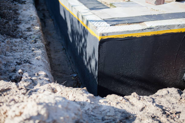 Professional Waterproofing technician working in Hingham, WI